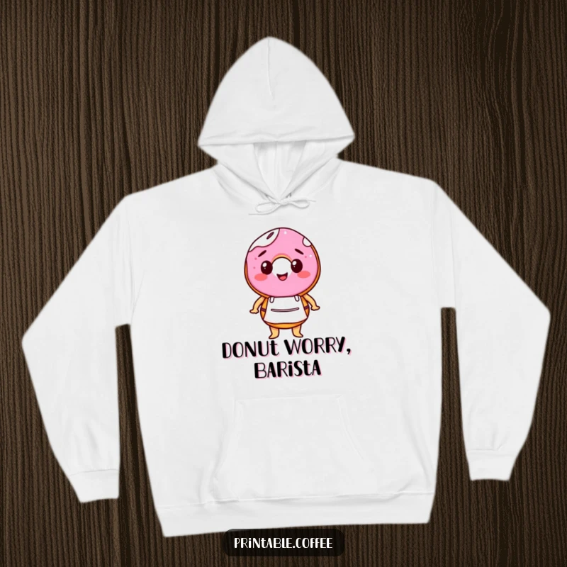 Funny hoodie featuring a happy donut character in a tiny barista apron, offering cozy comfort and a touch of sweet charm.