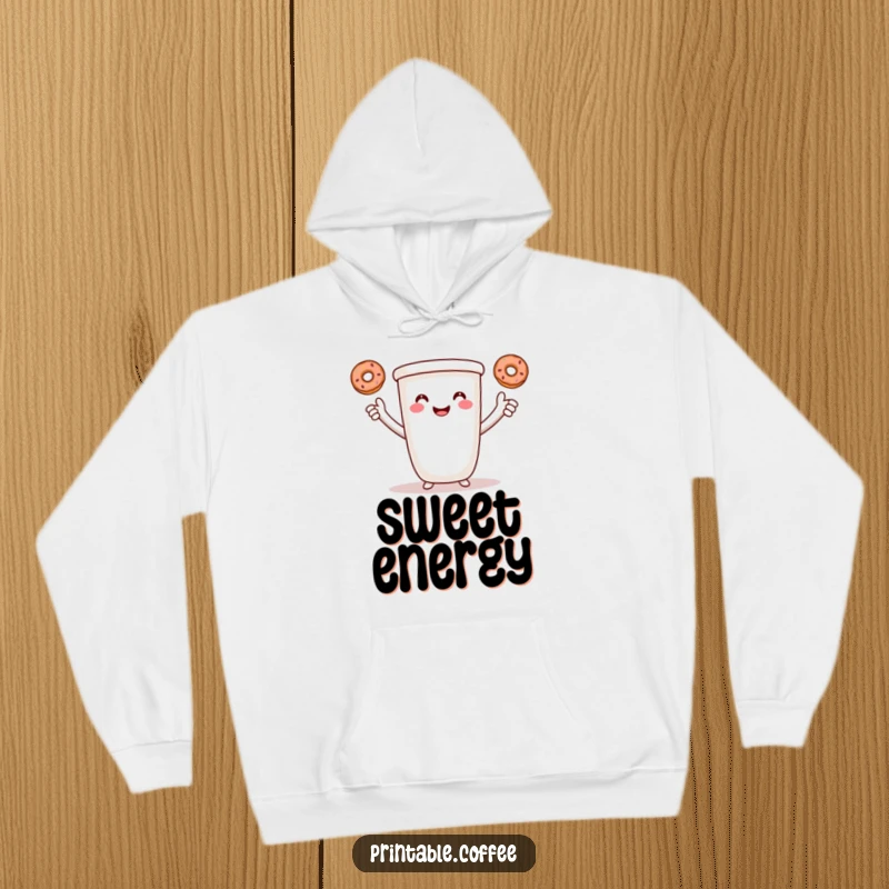 Funny coffee hoodie featuring a smiling cartoon coffee cup with arms, juggling three tiny donuts.